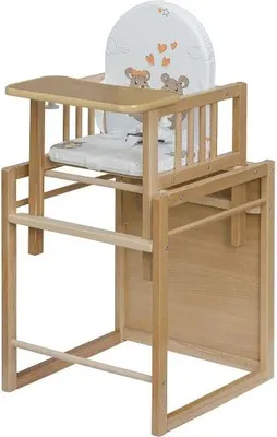 A wooden high chair with a white cushion and a tray.