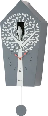 A gray cuckoo clock with a white tree and bird design, featuring a pendulum.