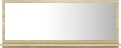 A mirror with a shelf below it, against a white background.