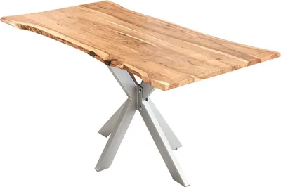 A wooden dining table with a live edge top and a silver spider-leg base, isolated on a white background.