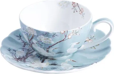 Produktbild von Porzellan-Kaffeetasse mit Untertasse, buntes Blumenmotiv, weiße Laubkrone