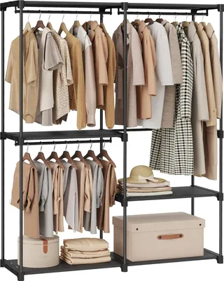 A black metal open wardrobe with clothes hanging on hangers and storage boxes on shelves.