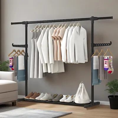 A clothing rack filled with clothes, shoes, and accessories, set against a gray wall.