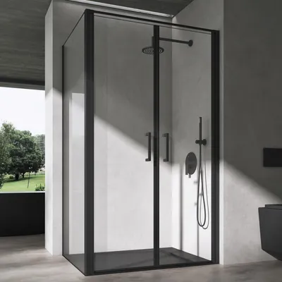 A modern bathroom with a black framed glass shower enclosure.