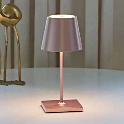 Zdjęcie produktu dla SIGOR akumulatorowa lampa stołowa Nuindie mini 25cm różowe złoto 2,2W FlexMood 2200K/2700K IP54 Ra85 z możliwością ściemniania
