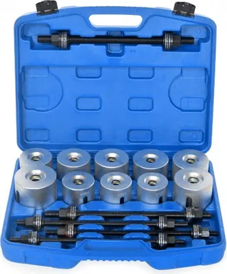 A blue plastic case containing a set of silver metal tools, likely for automotive repair.