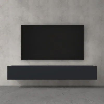 A black TV screen is mounted on a gray concrete wall above a dark gray floating TV stand.