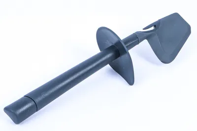 A dark gray kitchen spatula is shown against a white background.