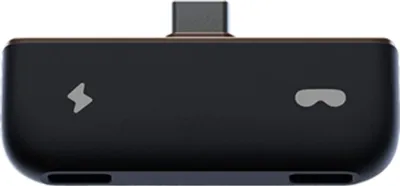 A close-up, top-down view of a black electronic device with a USB-C connector on top.
