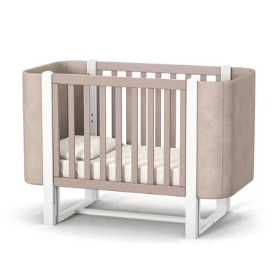 A baby crib with a mattress and pillow, shown from the front on a white background.