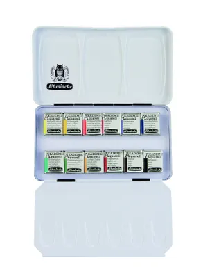 An open watercolor paint set with 12 half pans arranged in two rows inside a metal tin. The tin has a palette area in the lid.