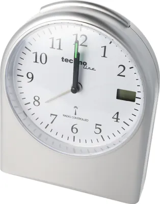 A close-up studio shot of a silver Technoline radio-controlled alarm clock with a white face.