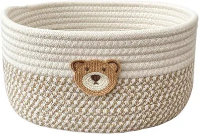 Imagen del producto de Cesta decorativa de algodón trenzado, ideal para el hogar. Es un armario de almacenamiento multifuncional y decorativo, perfecto para colgar en la pared o colocar en el salón. También es adecuado para dormitorios y baños