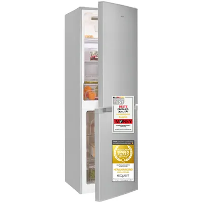 A silver refrigerator with its door slightly ajar, displaying internal shelves and food items. Several award stickers are affixed to the exterior of the door.