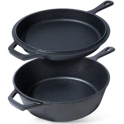 Two black cast iron cooking pans are stacked on a white background.
