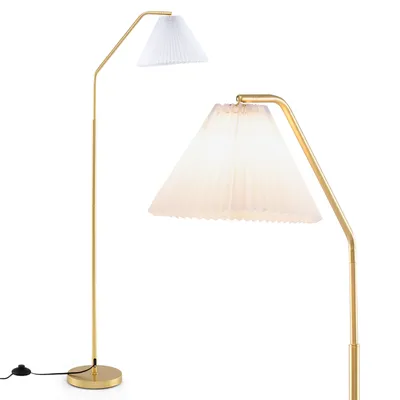 A floor lamp with a gold stand and a white pleated shade is shown against a white background.