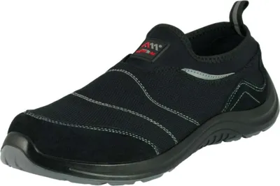 A black slip-on shoe with white stitching and a red logo tag.
