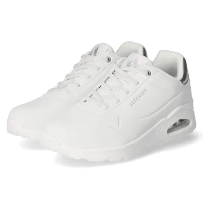 A pair of white Skechers sneakers shown from a side angle against a white background.