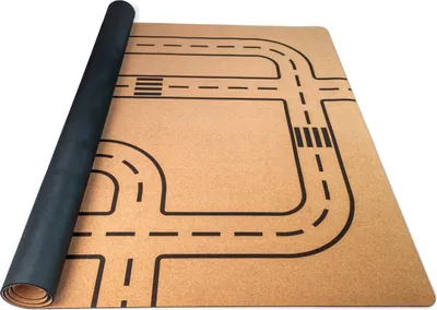 A rolled-up play mat with a road pattern is shown on a white background.
