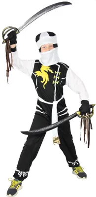 A child wearing a ninja costume and holding two swords.