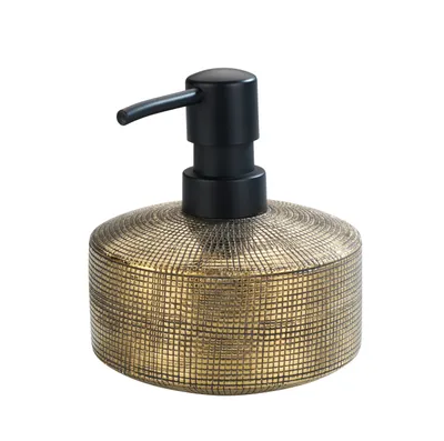 A gold and black soap dispenser on a white background.