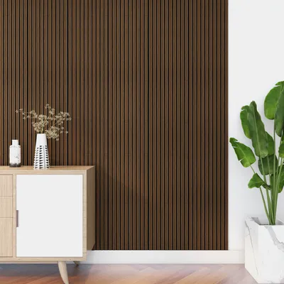 A close-up of a wall with wooden slats and a cabinet with decorative items.