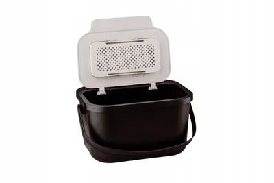 A black compost bin with an open beige lid with a perforated insert.