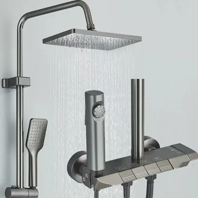 A modern shower fixture with a rainfall showerhead, handheld shower, and control panel.