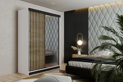A bedroom scene featuring a wardrobe, bed, and bedside table.