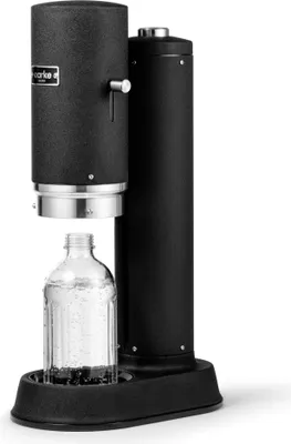 A black Aarke Carbonator Pro soda maker with a glass bottle is shown against a white background.