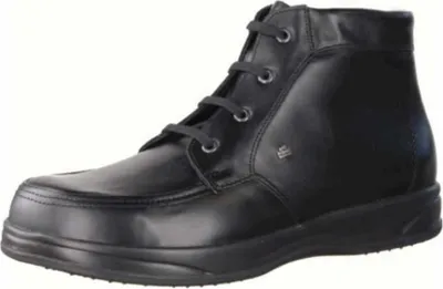 A single black leather boot on a white background.