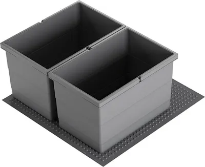 Two dark gray trash bins are placed side-by-side on a textured dark gray mat.