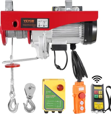 A product shot of an electric hoist and its accessories, including remote controls.