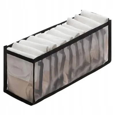 A storage organizer filled with folded items.