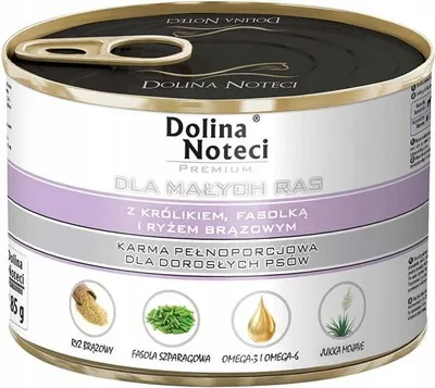 A close-up, slightly angled view of a round metal can of dog food.