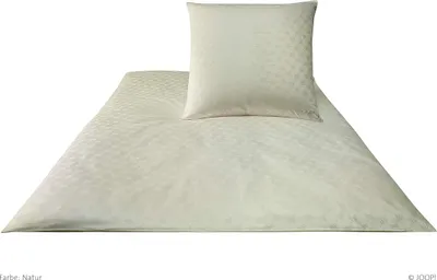 A cream-colored duvet cover and pillowcase set with a subtle geometric pattern, laid out on a white background.