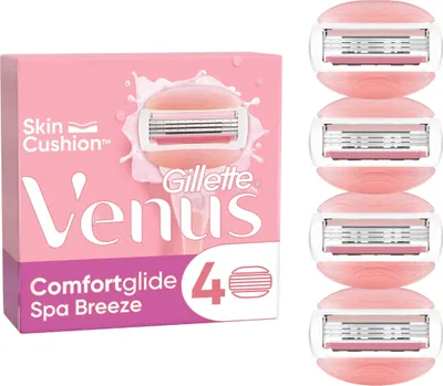 A package of Gillette Venus Comfortglide Spa Breeze women's razor blades and several individual razor blades.