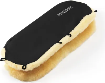 A black and cream sheepskin hand warmer for a stroller.