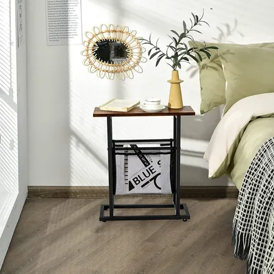 A bedside table with a magazine rack next to a bed.