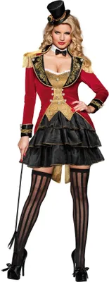 A woman in a circus director costume holding a whip.