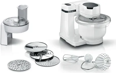 A white Bosch kitchen machine with various attachments is displayed on a white background.