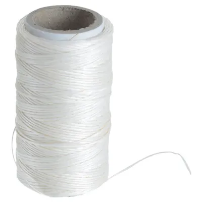 A spool of white kitchen twine on a white background.