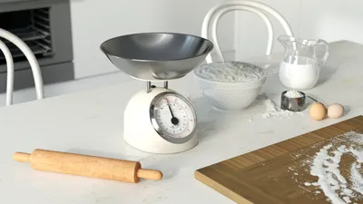 A kitchen counter with baking ingredients and tools.