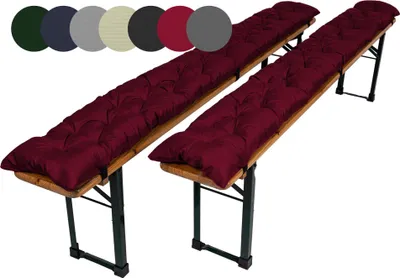 Two burgundy bench cushions on wooden benches.