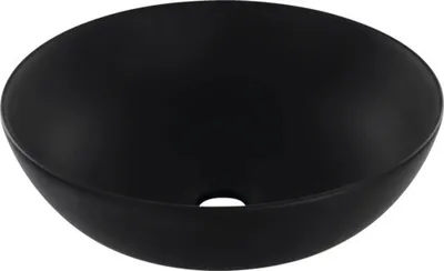 A black, matte finish vessel sink with a drain hole in the center.