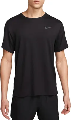 A man wearing a black Nike t-shirt and black shorts.