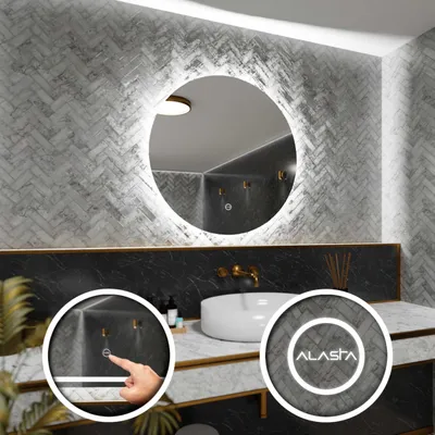 A modern bathroom vanity with a round LED mirror.