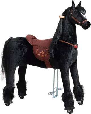 A black plush horse toy with a brown saddle and bridle, standing on a white background.