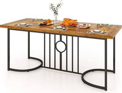 A dining table set for a meal with a roasted chicken and side dishes.