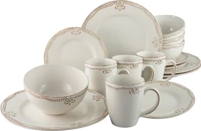 A collection of white ceramic dinnerware with a decorative brown trim, arranged on a white background.